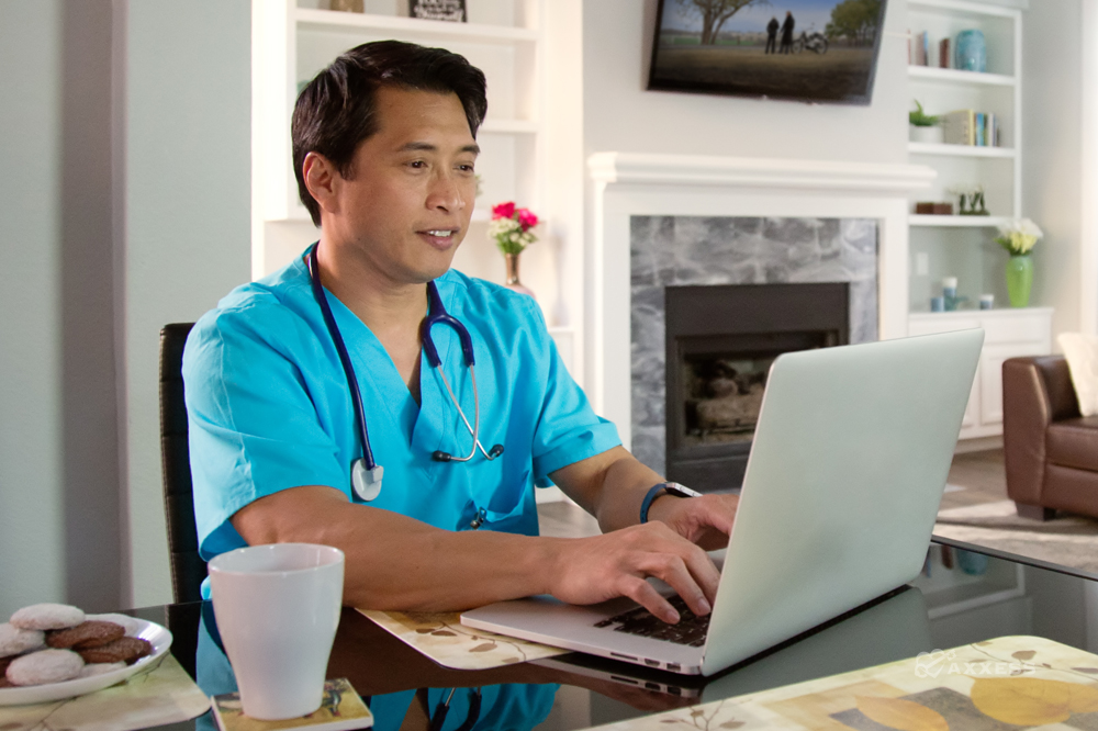 A nurse using a laptop