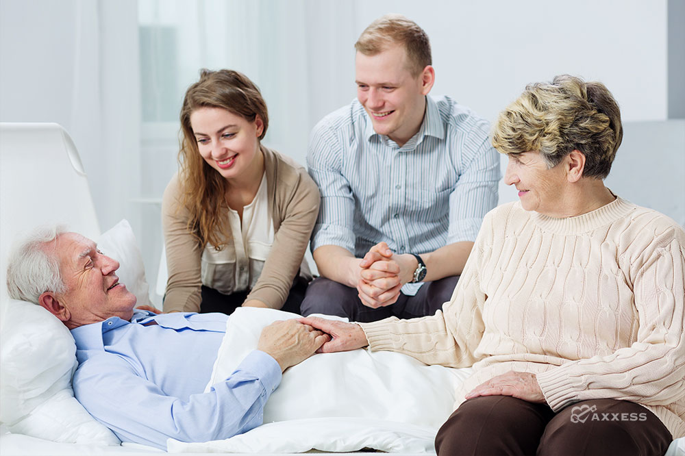 A hospice patient happy to see his family at his bedside