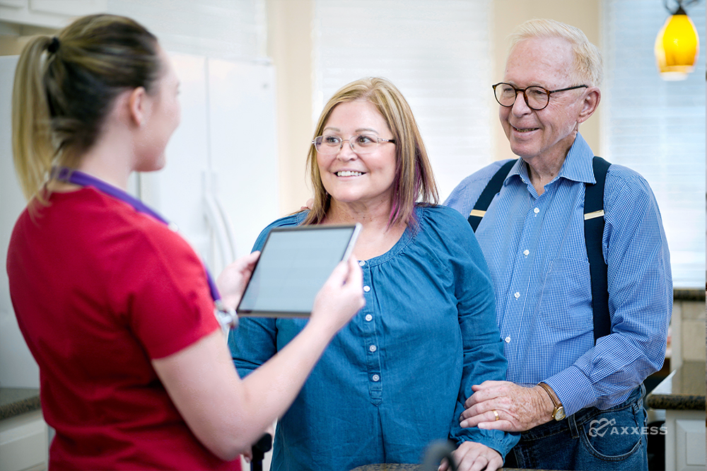 a nurse discussing pdgm home health with patients