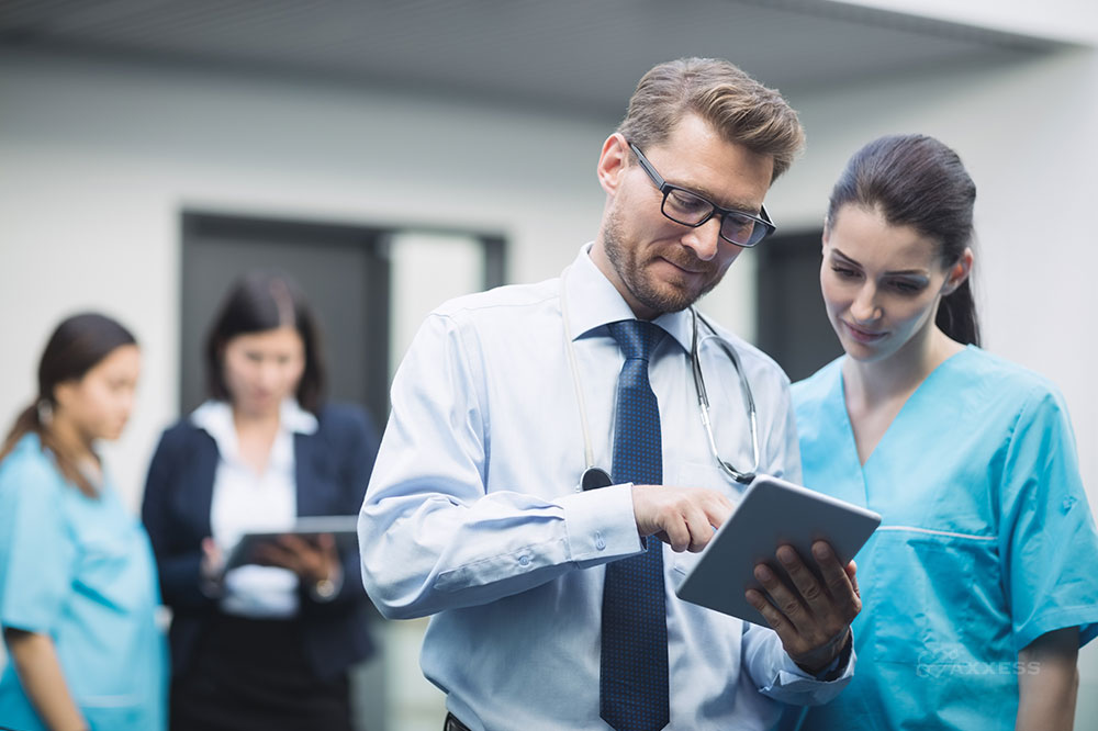 Clinical team reviews data on a tablet