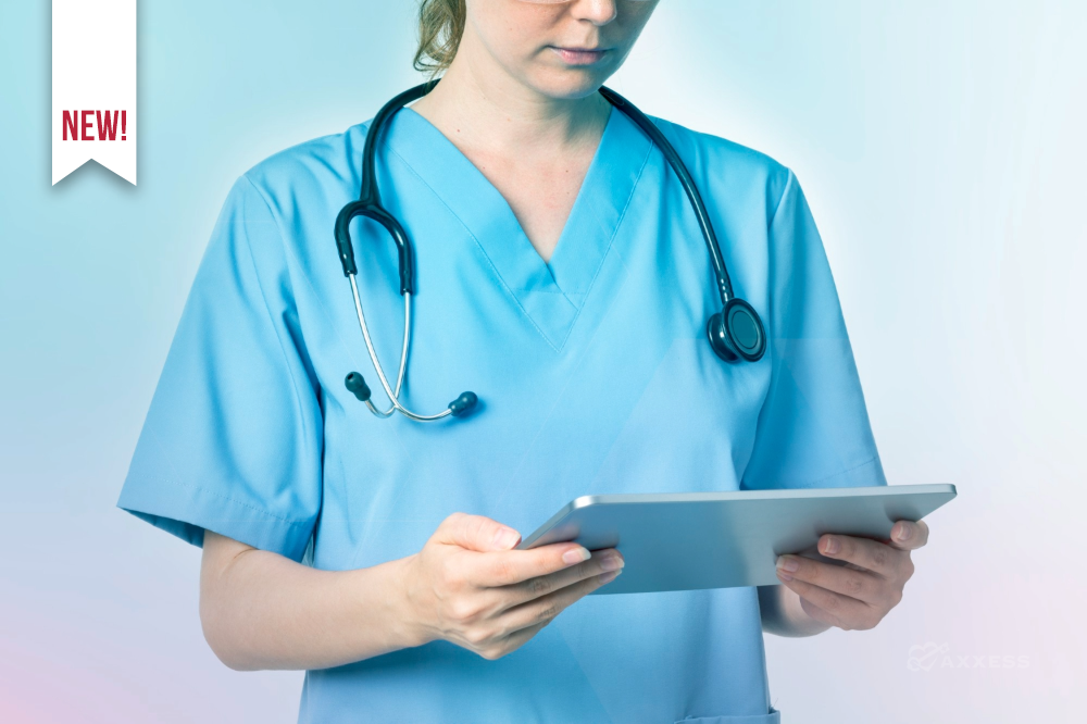 A healthcare professional in light blue scrubs with a stethoscope around their neck holds a tablet and reviews information on the screen. The softly lit background features blue and pink gradient tones, emphasizing a modern, technology‑enabled care setting.